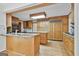 Traditional kitchen featuring wood cabinets, granite countertops and an island for a cooking and gathering space at 115 Ebenezer Church Rd, Fayetteville, GA 30215