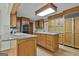 Traditional kitchen featuring wood cabinets, granite countertops and a light filled area at 115 Ebenezer Church Rd, Fayetteville, GA 30215
