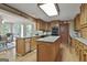 Traditional kitchen featuring wood cabinets, granite countertops and an island for a cooking and gathering space at 115 Ebenezer Church Rd, Fayetteville, GA 30215