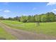 Picturesque property with a serene pond and white fencing, perfect for a peaceful country lifestyle at 115 Ebenezer Church Rd, Fayetteville, GA 30215