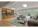 Bright and airy sunroom with skylights, hardwood floors, and custom built-in cabinets at 115 Ebenezer Church Rd, Fayetteville, GA 30215