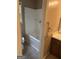 Bathroom showcasing a shower-tub combo next to a vanity with a sink and a toilet at 130 Sandy Dr, Stockbridge, GA 30281
