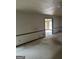 View of a living room area leading to a bedroom, showcasing the open floor plan at 130 Sandy Dr, Stockbridge, GA 30281