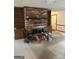 Living room featuring a brick fireplace, built-in shelving, and an adjacent doorway at 130 Sandy Dr, Stockbridge, GA 30281