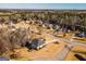 Aerial view showcases neighborhood homes in a scenic, wooded landscape at 118 Jasmine Way, Villa Rica, GA 30180
