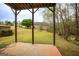 View of the lush backyard from the patio with a green lawn at 118 Jasmine Way, Villa Rica, GA 30180