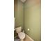 Simple half-bathroom with toilet and paper holder at 118 Jasmine Way, Villa Rica, GA 30180