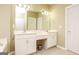 Well lit bathroom featuring double sink vanity with ample cabinet space and tile floors at 118 Jasmine Way, Villa Rica, GA 30180