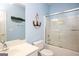 Bright bathroom with a tub-shower combination and nautical decorations at 118 Jasmine Way, Villa Rica, GA 30180
