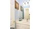 Bathroom with a white vanity, compass art, and a decorative whale at 118 Jasmine Way, Villa Rica, GA 30180