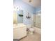 Bright bathroom with vanity, toilet, and tiled floors at 118 Jasmine Way, Villa Rica, GA 30180