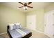 Cozy bedroom with neutral walls, ceiling fan, and plush carpeting at 118 Jasmine Way, Villa Rica, GA 30180