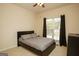 Bedroom with dark furniture and lots of natural light at 118 Jasmine Way, Villa Rica, GA 30180