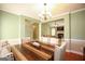 Inviting dining room with pendant lighting, decor, and an open view to the living room, showcasing modern design at 118 Jasmine Way, Villa Rica, GA 30180