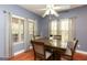 Cozy dining room with a ceiling fan, hardwood floors, and neutral-toned decor for easy customization at 118 Jasmine Way, Villa Rica, GA 30180