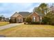 Charming single-story brick home with well-manicured lawn and a paved driveway leading to a welcoming entrance at 118 Jasmine Way, Villa Rica, GA 30180