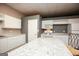 Modern kitchen with white cabinets, granite countertops, island and stainless appliances at 118 Jasmine Way, Villa Rica, GA 30180