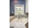 Elegant kitchen sink with a modern faucet and a bright window view, complemented by stylish backsplash at 118 Jasmine Way, Villa Rica, GA 30180