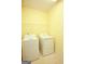 Bright laundry room with washer, dryer and shelving at 118 Jasmine Way, Villa Rica, GA 30180