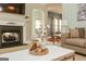 Living room featuring a fireplace and a coffee table with decorative accessories at 118 Jasmine Way, Villa Rica, GA 30180
