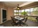 Inviting covered patio with a ceiling fan and dining set, perfect for outdoor entertaining at 118 Jasmine Way, Villa Rica, GA 30180