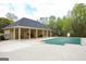Community pool area with a covered pool, seating, and ample recreation space at 118 Jasmine Way, Villa Rica, GA 30180