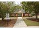 Charming pool house with brick exterior, offering a relaxing space near the community pool at 118 Jasmine Way, Villa Rica, GA 30180