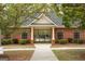Well-maintained pool house featuring brick architecture and access to the community pool at 118 Jasmine Way, Villa Rica, GA 30180