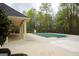Community pool area with a covered pool and ample space for relaxation and recreation at 118 Jasmine Way, Villa Rica, GA 30180