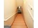 Bright staircase with light wood steps and white railing leading to the upper level at 118 Jasmine Way, Villa Rica, GA 30180