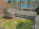 Aerial view of home featuring a well-manicured lawn and a lake in the background at 150 Mary Lynn Ln, Fayetteville, GA 30214