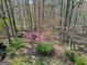 Aerial view of a wooded backyard featuring mature trees, shrubs and foliage, a natural outdoor space at 150 Mary Lynn Ln, Fayetteville, GA 30214
