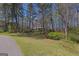 Scenic backyard featuring mature trees and landscaping, creating a tranquil and picturesque outdoor environment at 150 Mary Lynn Ln, Fayetteville, GA 30214