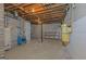 Utility area in the basement with water heater, shelving, and concrete block walls at 150 Mary Lynn Ln, Fayetteville, GA 30214