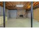 Unfinished basement space with brick fireplace and exposed ceiling, perfect for customization at 150 Mary Lynn Ln, Fayetteville, GA 30214