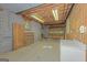 Unfinished basement area leading to the garage with concrete floors and concrete block walls at 150 Mary Lynn Ln, Fayetteville, GA 30214