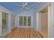 Spacious bedroom with wood floors and interesting ceiling features a window, a closet, and a fan at 150 Mary Lynn Ln, Fayetteville, GA 30214