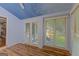 Spacious bonus room featuring wood floors, an interesting ceiling, and natural light from large windows at 150 Mary Lynn Ln, Fayetteville, GA 30214