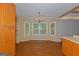 Bright dining room with hardwood floors, a bay window, and wooden cabinetry at 150 Mary Lynn Ln, Fayetteville, GA 30214