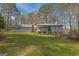 Charming single-story home with a large front yard surrounded by mature trees, offering a serene and private setting at 150 Mary Lynn Ln, Fayetteville, GA 30214