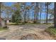 Scenic view of a property overlooking a serene lake, surrounded by lush trees and greenery at 150 Mary Lynn Ln, Fayetteville, GA 30214