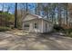 Detached garage with an adjacent outdoor parking area, offering ample parking and storage options at 150 Mary Lynn Ln, Fayetteville, GA 30214