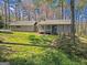 Inviting exterior featuring a charming front porch, well-manicured lawn, and a lovely home with a stone accent at 150 Mary Lynn Ln, Fayetteville, GA 30214
