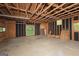 Spacious unfinished garage featuring exposed wood beams, natural light, and ample storage potential at 150 Mary Lynn Ln, Fayetteville, GA 30214