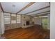 Spacious living room with hardwood floors, stone fireplace, and built-in shelving at 150 Mary Lynn Ln, Fayetteville, GA 30214