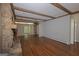 Spacious open-concept living room with beautiful hardwood floors and stone fireplace at 150 Mary Lynn Ln, Fayetteville, GA 30214