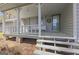 Charming covered front porch with stone supports and seating, creating a welcoming entrance to the home at 150 Mary Lynn Ln, Fayetteville, GA 30214