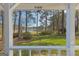 Picturesque view from the porch overlooking a lush green lawn, serene lake, and mature trees, a true nature escape at 150 Mary Lynn Ln, Fayetteville, GA 30214