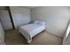Bedroom with neutral carpeting, crisp white walls, a full bed, and two closet doors at 771 Franklin Mill Trce, Loganville, GA 30052