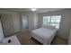 Bedroom features a walk-in closet and a window at 771 Franklin Mill Trce, Loganville, GA 30052